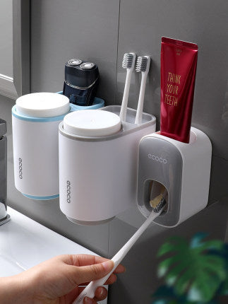 Automatisk tandkräms hållare