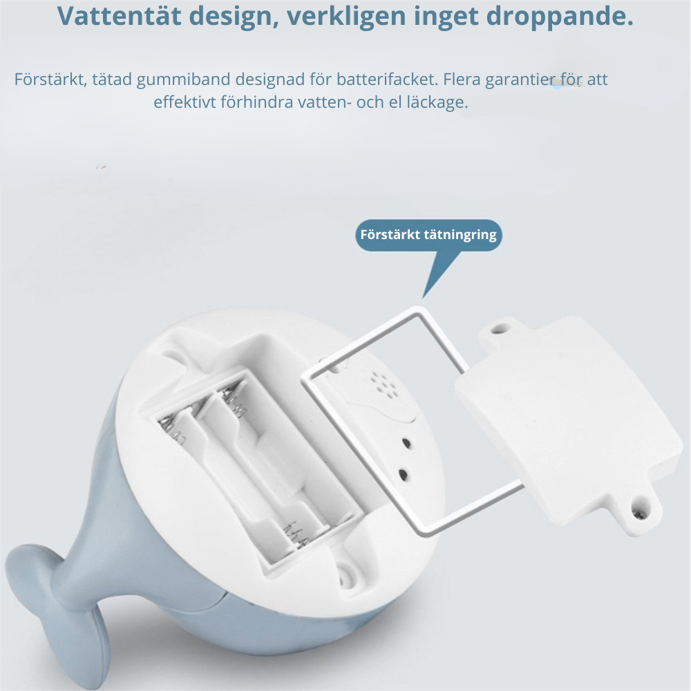 Flytande val som sprutar vatten med ljus och musik.